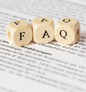 faq letter dice sitting on a book